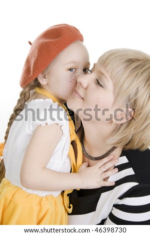 Daughter kissing her mother. Isolated on white.