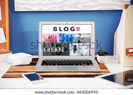 Workplace with different devices and table on blue wall background. Blog concept .