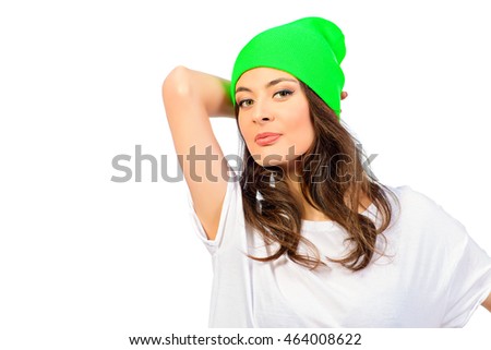 Cute young girl in everyday clothes posing at studio. Isolated over white backgroud.
