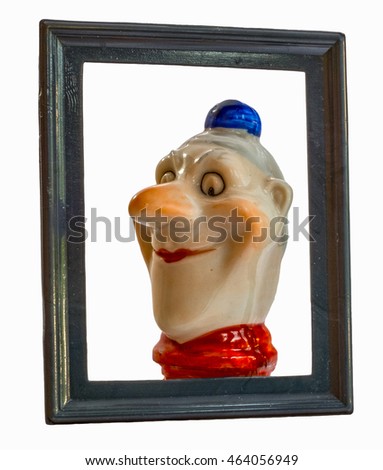 Funny clown with red nose and blue hat in picture frame. 