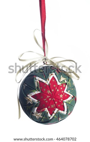 A christmas ball made of fabric, tree ornament isolated over white background.