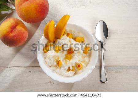 Mousse with peaches served in a bowl and plate