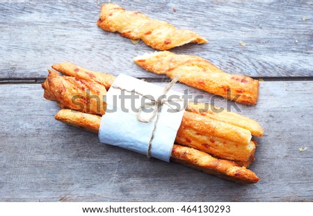 Close up of cheese bread sticks on a wooden background