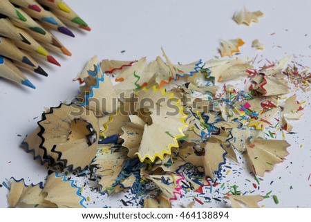 Colour pencils. Shavings from pencils. Located on a white background.