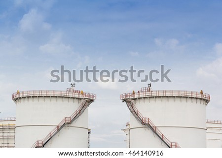 chemical steel silo, fuel oil tank against blue sky with cloud 