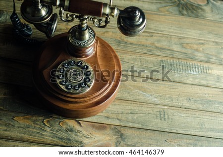 vintage telephone on wooden background