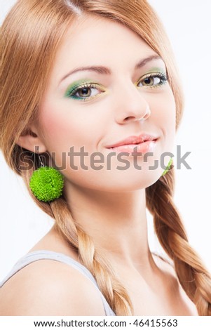 Young girl with green flower earring portrait