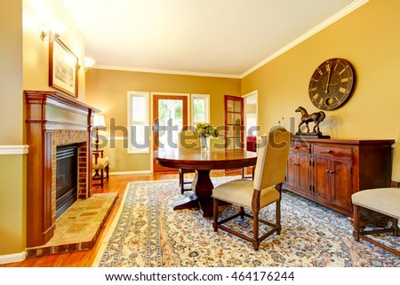 Horse ranch dining room with fireplace and wooden cabinet. Northwest, USA