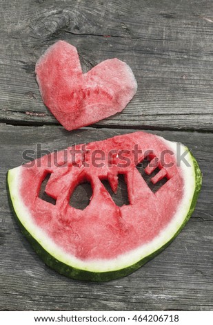 Fresh juicy watermelon slice close-up with love letters word