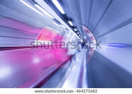 Tunnel to the subway or airport with a moving track - abstract motion blur shot