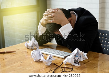 businessman bend down the head on the table he feel frustrated Royalty-Free Stock Photo #464280092