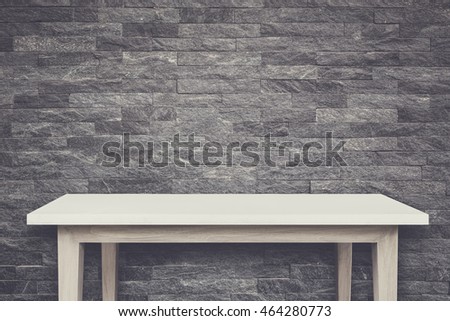 Empty top of natural stone table and stone wall background. For product display. Retro and vintage style