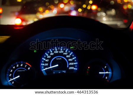 dial-mile car - front view of traffic jam and driving at night
 Royalty-Free Stock Photo #464313536
