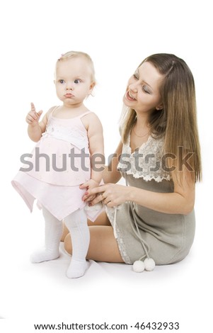 Young and beautiful mother with her sweet little daughter isolated on white.