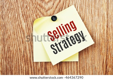 Selling Strategy. Marketing concept text written on a note paper sticker