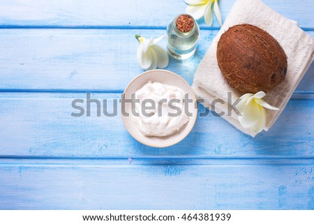 Organic spa products.  Coconut, coconut oil and cream l on  wooden background. Selective focus. Place for text.