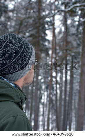 young guy looks forest Royalty-Free Stock Photo #464398520