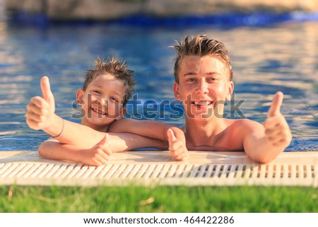 two young brothers in the pool