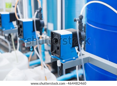 Chemical pump used  in waste water treatment,water filtration plants.the feed pump chemical into the pipe water.blur background selective focus. Royalty-Free Stock Photo #464482460