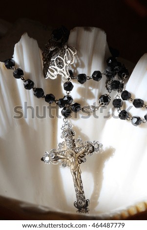 silver rosary with holy Christ