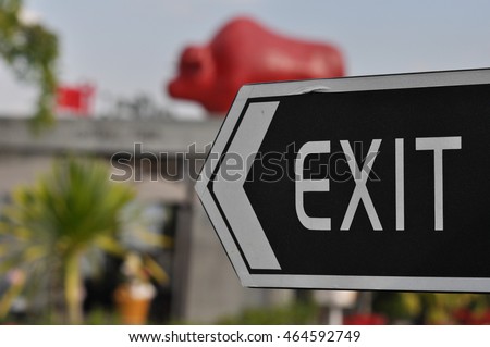 EXIT sign in black background.