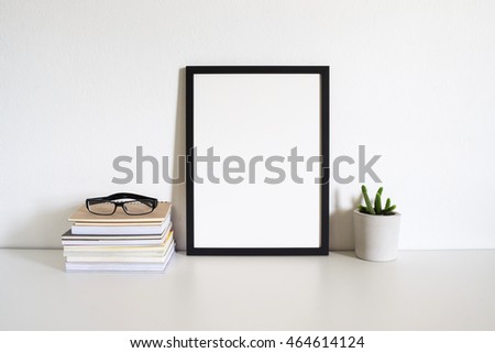 mock up blank photo frame on table.home office decor