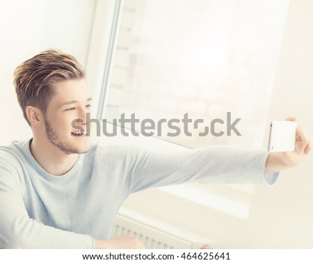 Student takes a selfie picture in a classroom