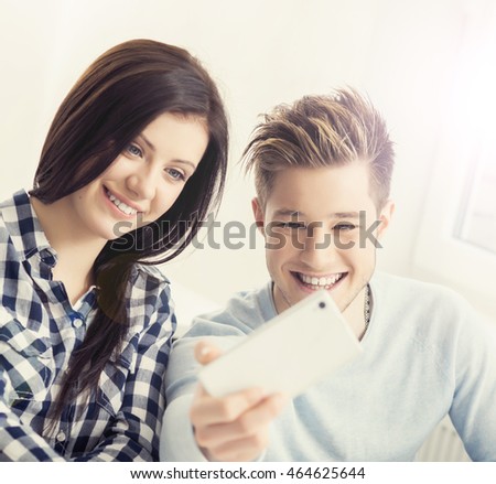 Boy and girl taking selfie on a lesson at chool.