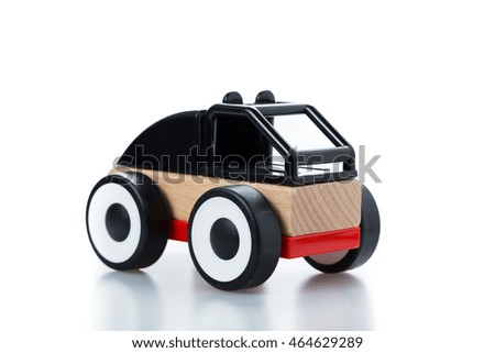 wooden toy race car on white background.