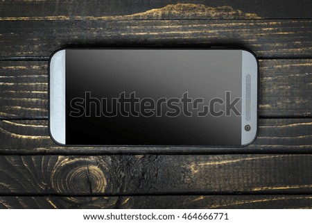 Phone closeup on wooden table