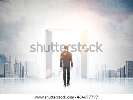 Businessman in suit entering doorway in wall with New York panorama pictured on it. Concept of founding new business in big city.