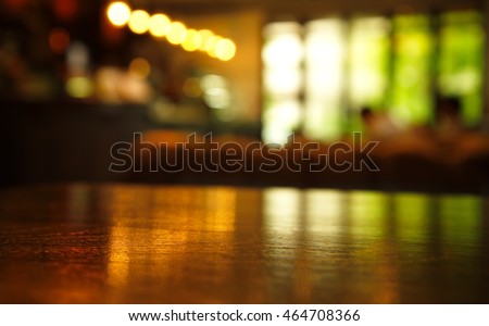 blur light reflection on table in bar at night background Royalty-Free Stock Photo #464708366