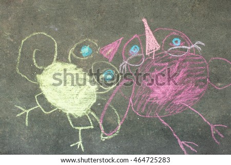 Children's drawings in chalk on the pavement