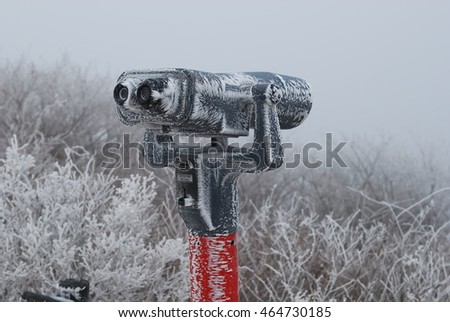 Frosted binocular on the mountain