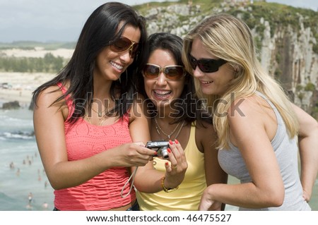 Women photograph on the beach