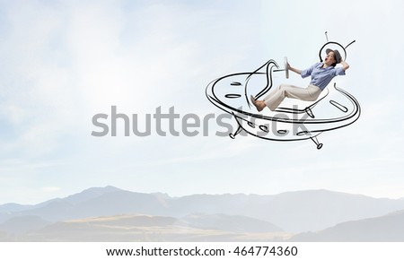 Girl flying in spaceship . Mixed media