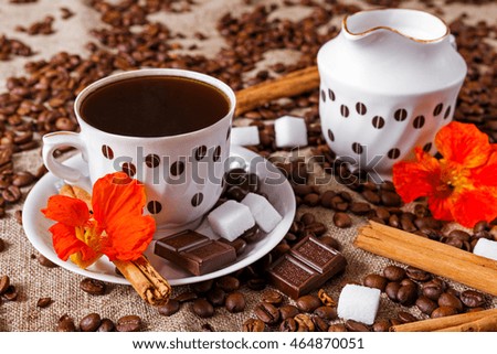 Old coffee cup with chocolate, milk, sugar, cinnamon and  beans