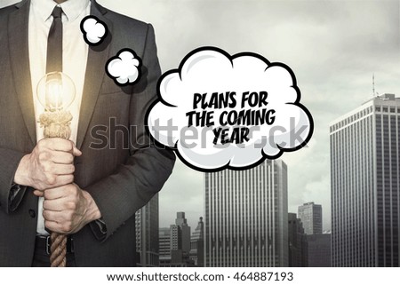 Plans for the coming text on speech bubble with businessman
