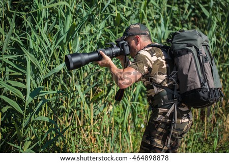 Professional nature and wildlife photographer at work