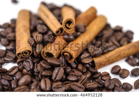Coffee beans and Cinnamon on the white background - isolated