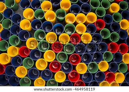 Background Shot Glass placed Multi Colorful Art Yellow, red, green, blue of ceramic blow for the game vintage in local Thailand.
