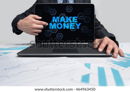 Businessman is pointing on virtual screen and selecting "Make money".