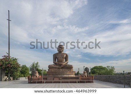 An idol of Lord Mahavir, founder of Jainism, at a temple in New Delhi, India. Royalty-Free Stock Photo #464963999