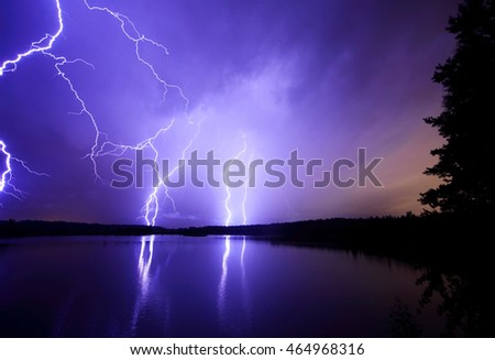 blue lightning bolts in the night skies