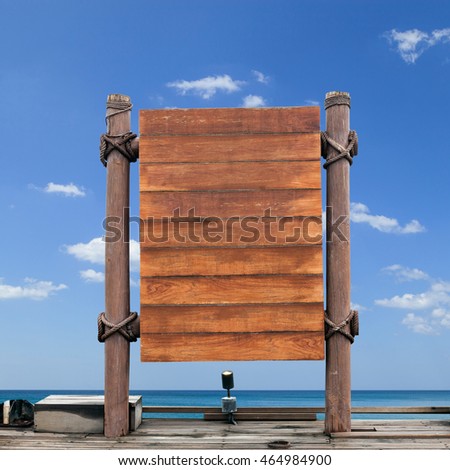 wooden signboard on sky background