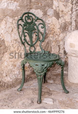 old green iron chairs