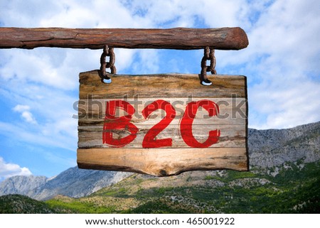 B2C motivational phrase sign on old wood with blurred background