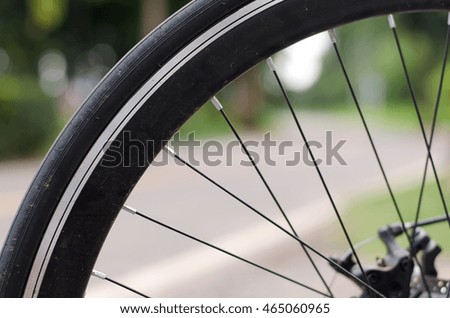 Bicycle wheel with Road cycling blur.