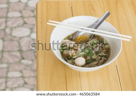 Pork noodle on the wooden table