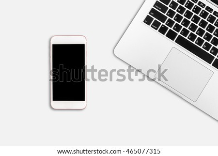 Laptop and smart phone on office desk